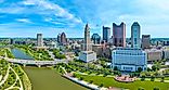 Aerial panorama Columbus Ohio with bright blue sky with clouds and bridge over Scioto river