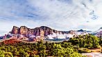 Clouds hanging around Lee Mountain, Munds Mountain and other red rock mountains surrounding the town of Sedona in northern Arizona in Coconino National Forest