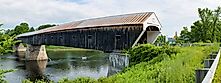 The historic Cornish Windsor Covered Bridge over the river.