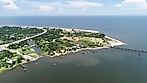 A gorgeous body of land on the edge of St Louis Bay. You can see piers along the shore line as well as a river that runs through the town.