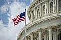 Washington DC Capitol dome detail with waving american flag