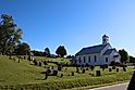 Old white church and graveyard in rural tennessee.