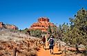 Family on spring hiking trip in red mountains. Family walking on pathway on Bell Rock Loop. Bell Rock is a butte just north of Village of Oak Creek, Arizona, south of Sedona in Yavapai County.USA.