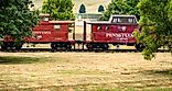 Chambersburg Pennsylvania USA 7-22-2024 Pennsylvania railroad red 1942 cabin car and 1916 unmodified caboose built at Altoona car shops. Editorial credit: Robert Hale / Shutterstock.com