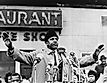 Bayard Rustin, half-length portrait, facing front, microphones in foreground / World Telegram & Sun photo by Stanley Wolfson. Editorial credit: New York World-Telegram and the Sun staff photographer: Wolfson, Stanley, photographer., Public domain, via Wik