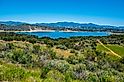 View of Lake Cachuma and the green rolling hills of Los Padres National Forest above and the Santa Ynez Valley of central Santa Barbara County, California
