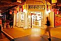 A man walks in front of a souvenir store in the Underground Atlanta shopping area. Editorial credit: James Kirkikis / Shutterstock.com