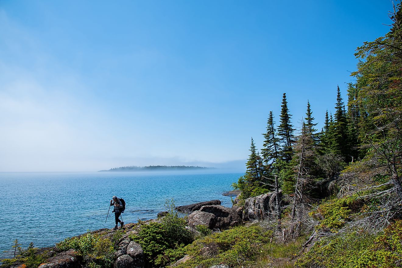 Backpacker hikes across ridge on Isle Royale National Park