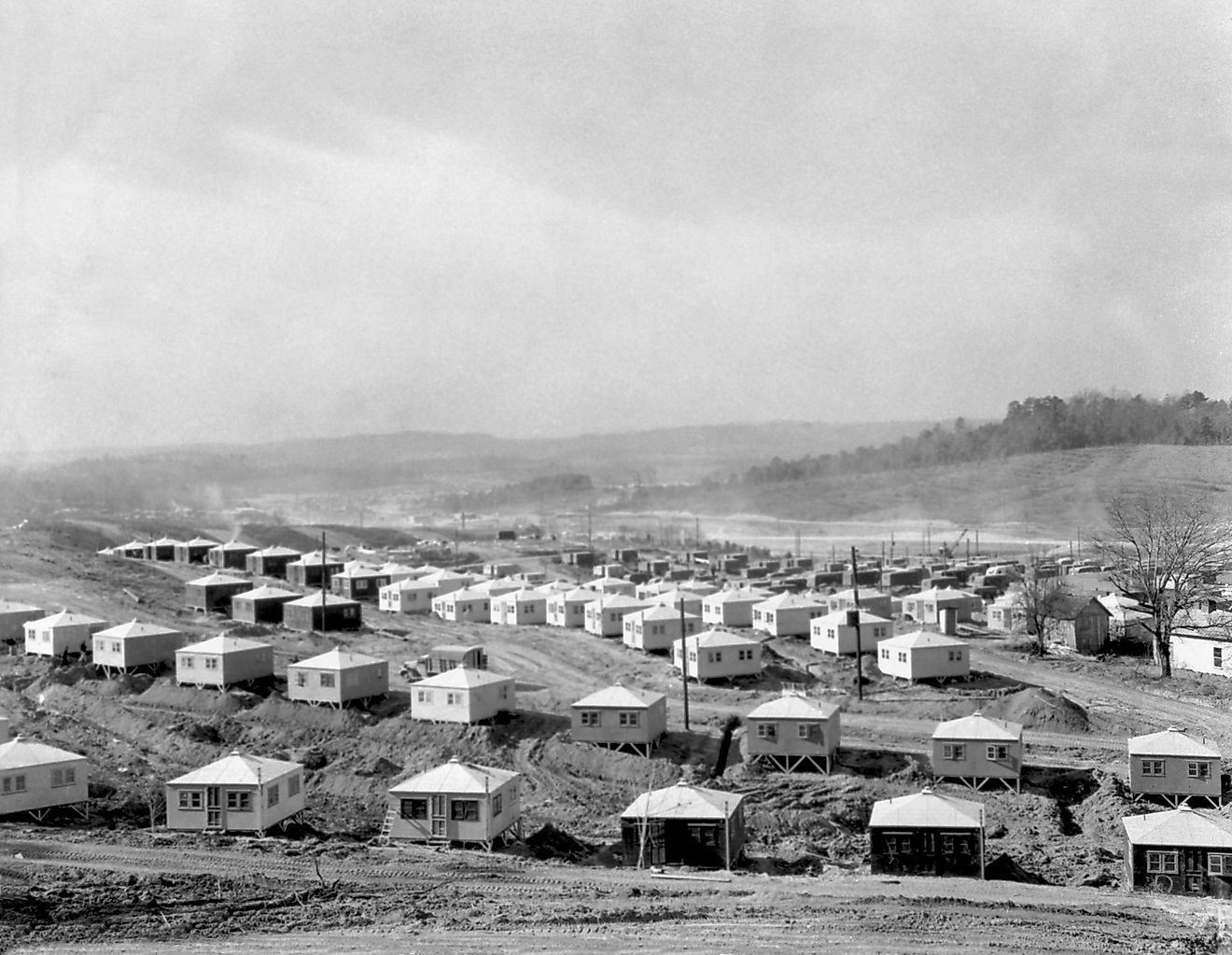 Small and simple homes under construction in Oak Ridge, Tennessee. 1945. They are for workers of the Manhattan Project's Clinton Engineering Works.