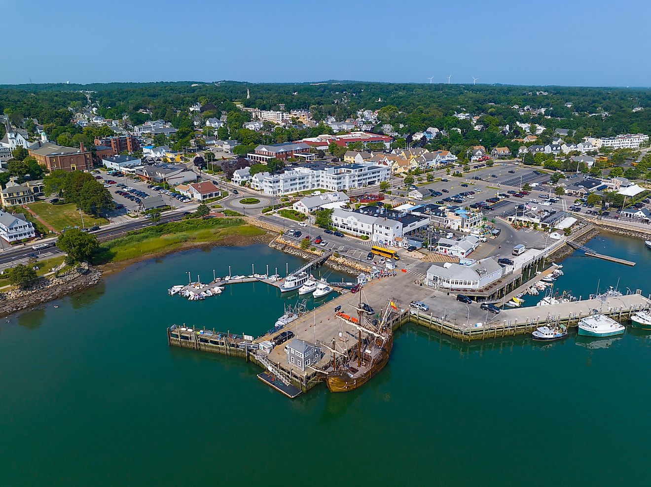 Plymouth town wharf aerial view including historic tall ship Nao Trinidad in historic town center of Plymouth, Massachusetts