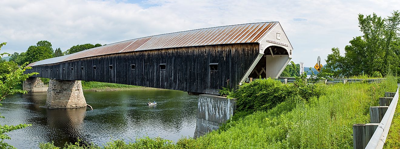 The historic Cornish Windsor Covered Bridge over the river.
