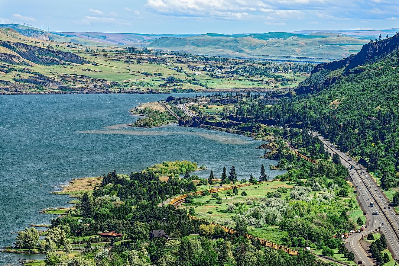 Railroad tracks and Interstate 84 run along the riverside in the Columbia River Gorge, Oregon, USA