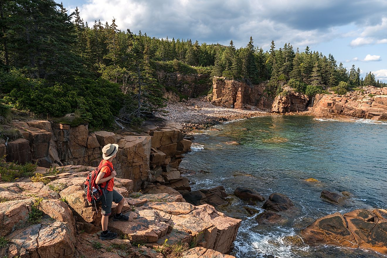 hiker taking in the views in Acadia National Park