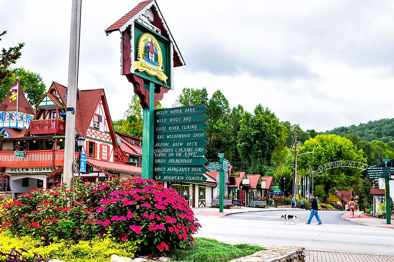 Helen, Georgia Bavarian village traditional German architecture roof and colorful house and direction sign for restaurant. Editorial credit: Andriy Blokhin / Shutterstock.com