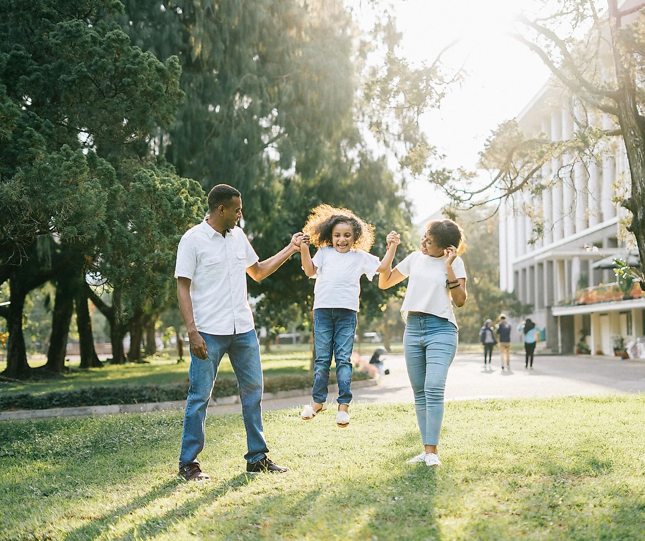 family playing in green space. Editorial credit: Agung Pandit Wiguna via Pexels