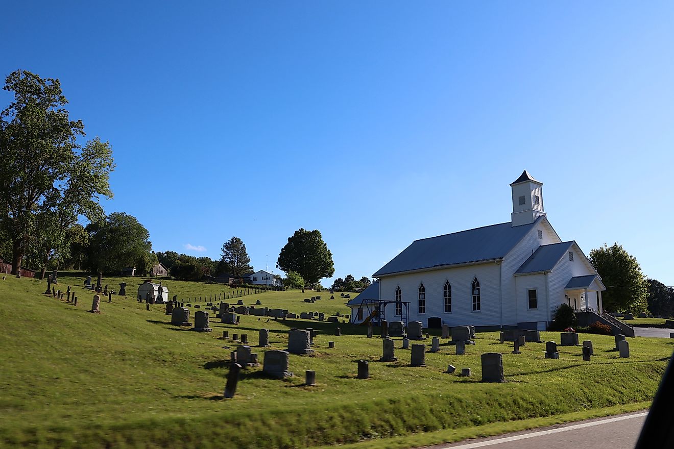 Old white church and graveyard in rural tennessee.
