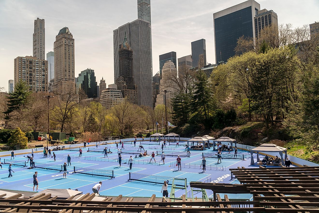 Pickleball players in the Wollman Ice Skating rink, converted into 14 pickleball courts. New York, NY. Editorial credit: rblfmr / Shutterstock.com