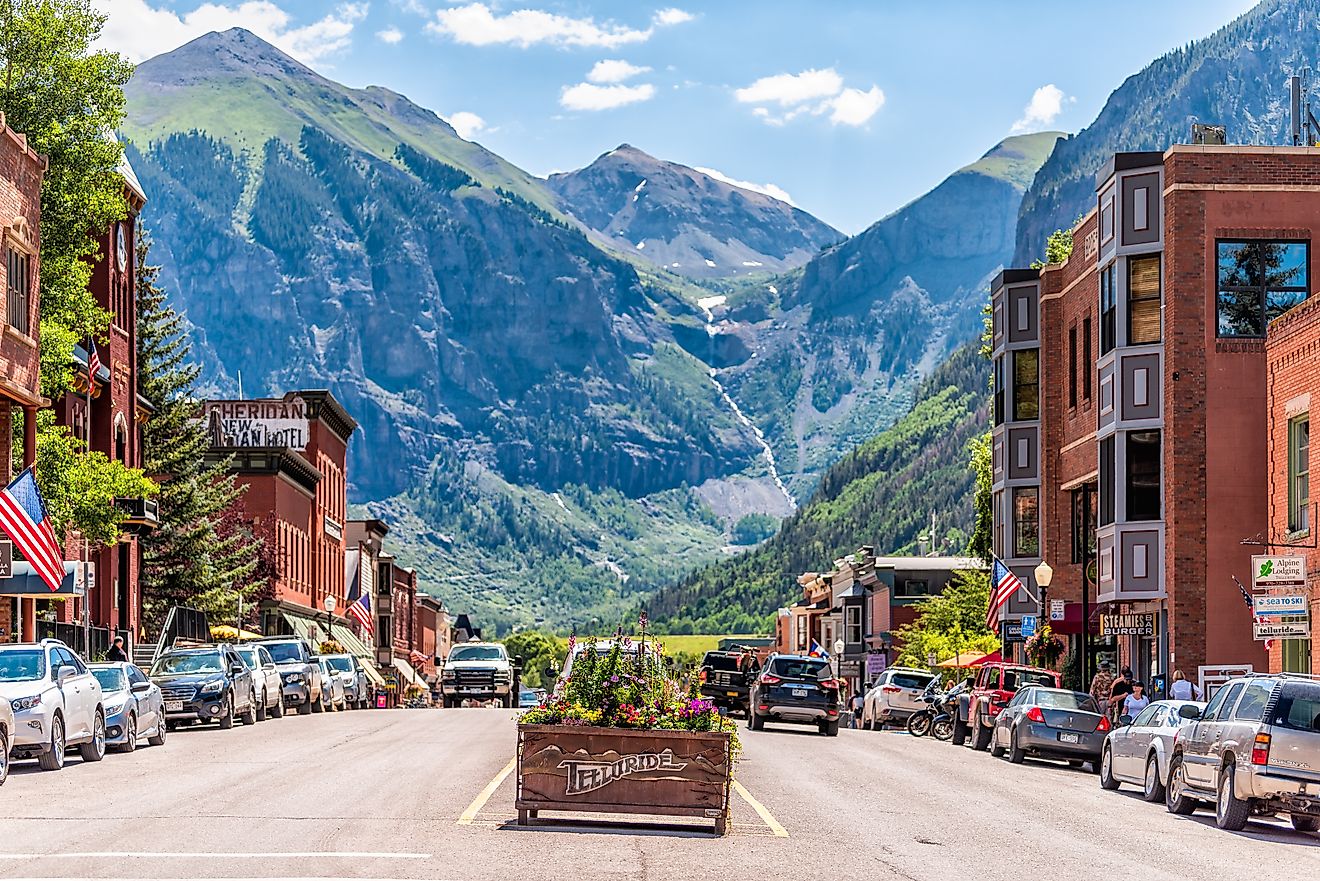 Small town village in Colorado with sign for city and flowers by historic architecture on main street mountain view. Editorial credit: Kristi Blokhin / Shutterstock.com