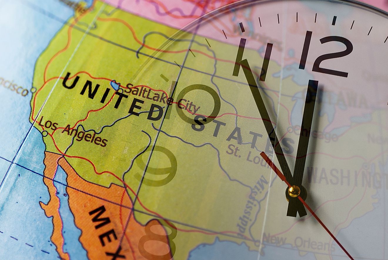 Double exposure of colorful globe with United States and clock