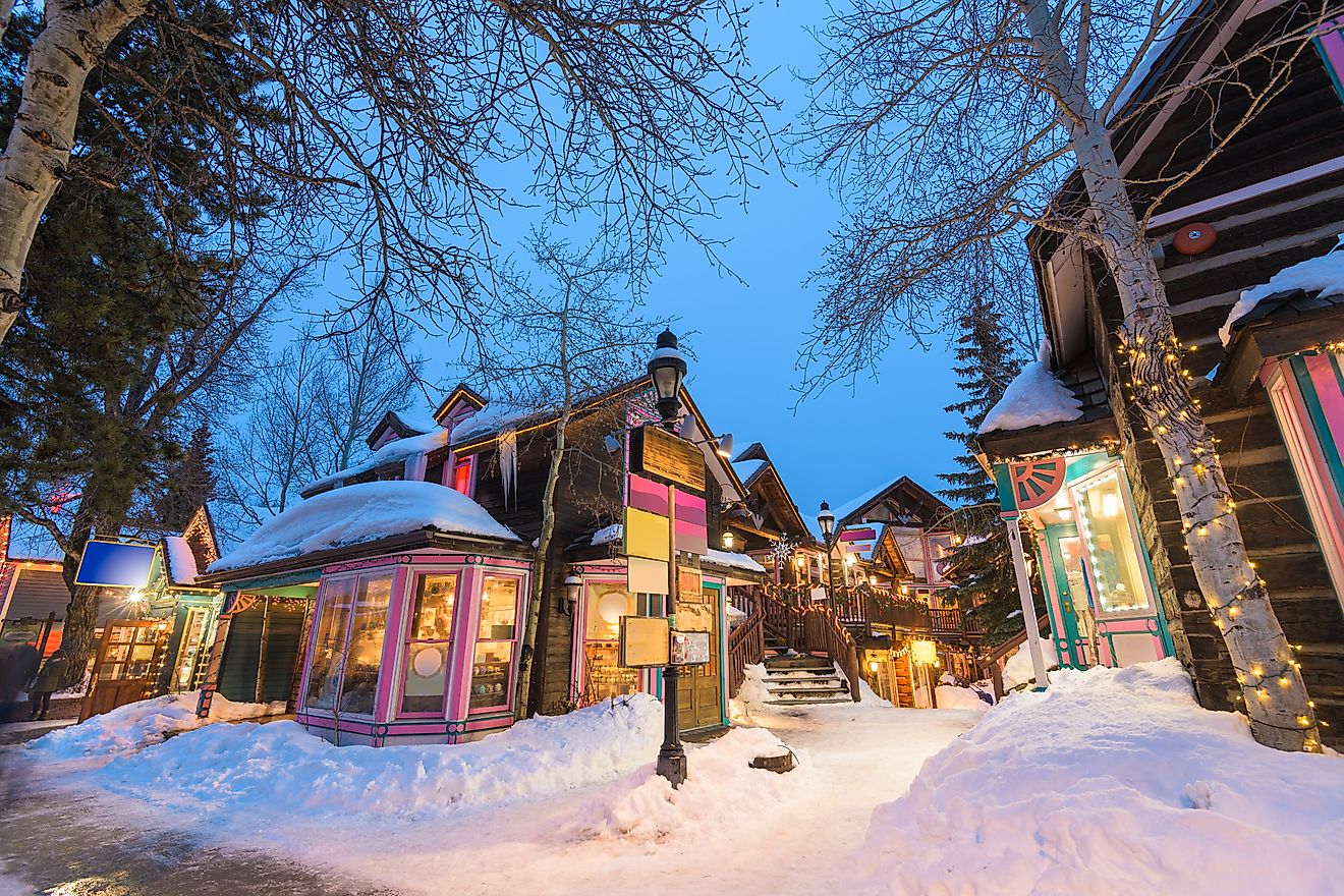 Breckenridge, Colorado, USA downtown streets at night in the winter with holiday lighting.