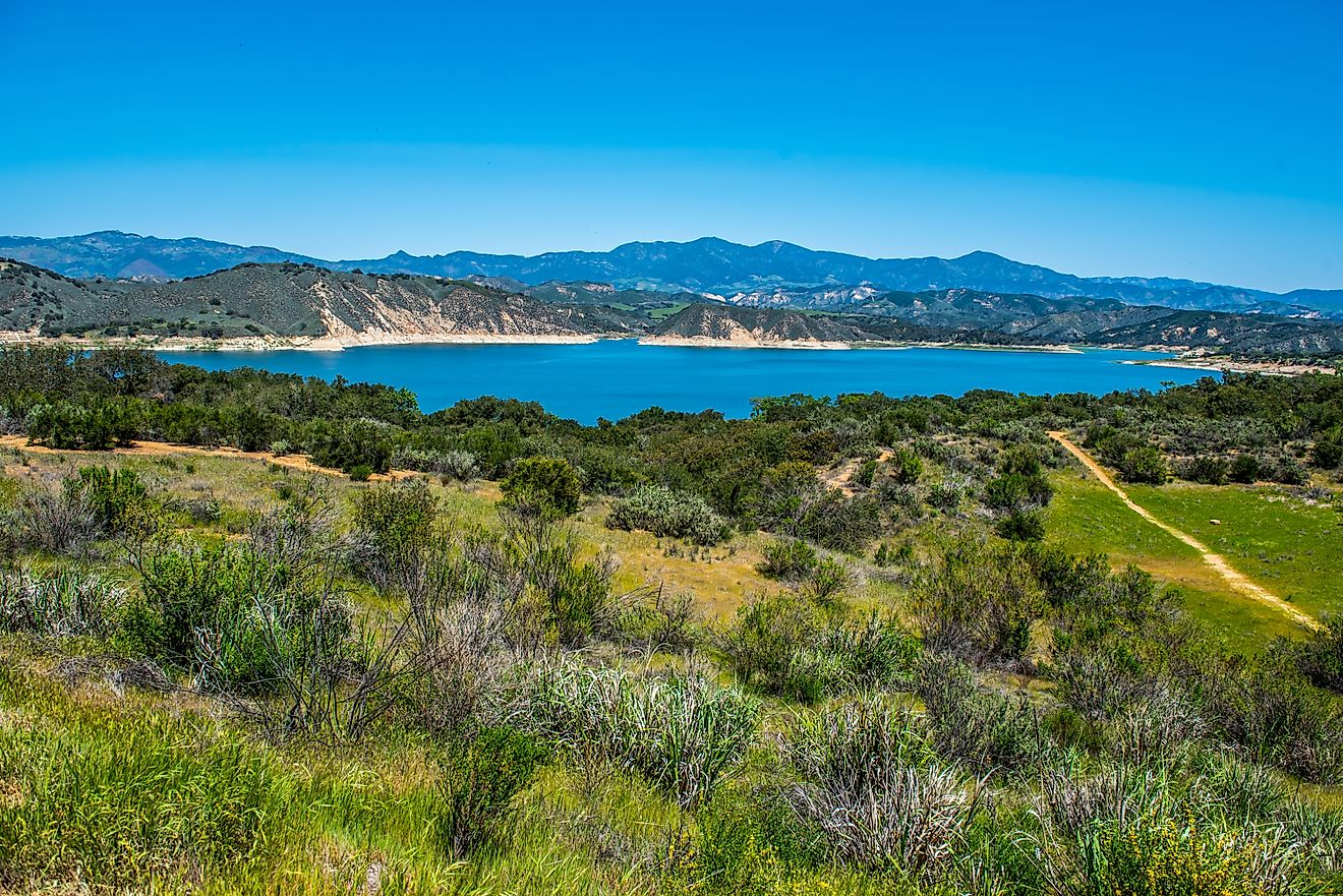 View of Lake Cachuma and the green rolling hills of Los Padres National Forest above and the Santa Ynez Valley of central Santa Barbara County, California