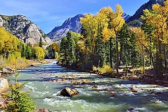 mountain river and colourful mountains of Colorado during foliage season