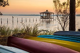 Colorful canoes on the shore of Mobile Bay, at Fairhope Alabama