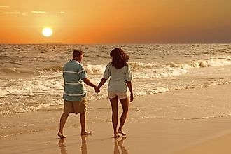 A couple walking together on the Alabama Gulf Coast.