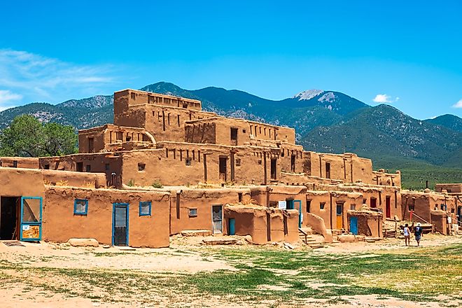 Tourists visit the historic Taos Pueblo
