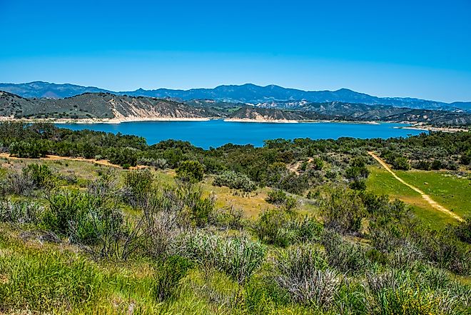 View of Lake Cachuma and the green rolling hills of Los Padres National Forest above and the Santa Ynez Valley of central Santa Barbara County, California