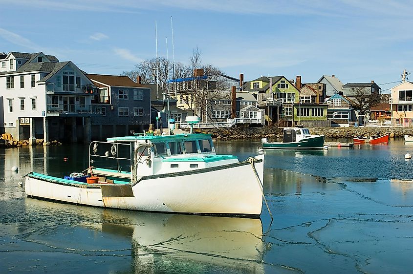 Lobster boats in the frozen inner harbor of Rockport at the tip of the Cape Ann peninsula on Atlantic coast of Massachusetts