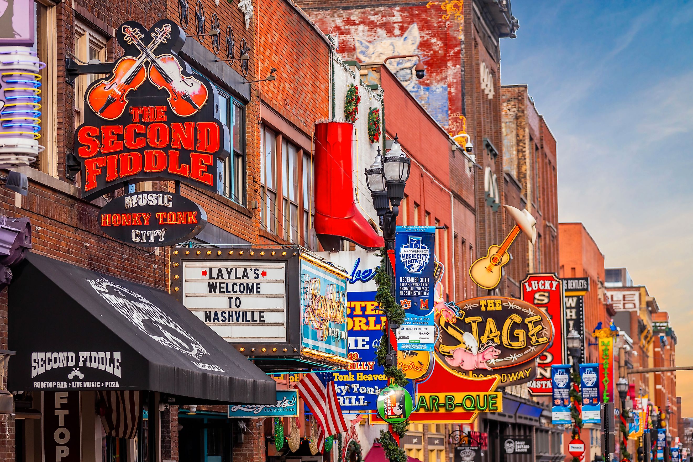 Famous Neon signs of blues clubs on Beale street at day in downtown Nashville city attraction. Editorial credit: Photo Spirit / Shutterstock.com