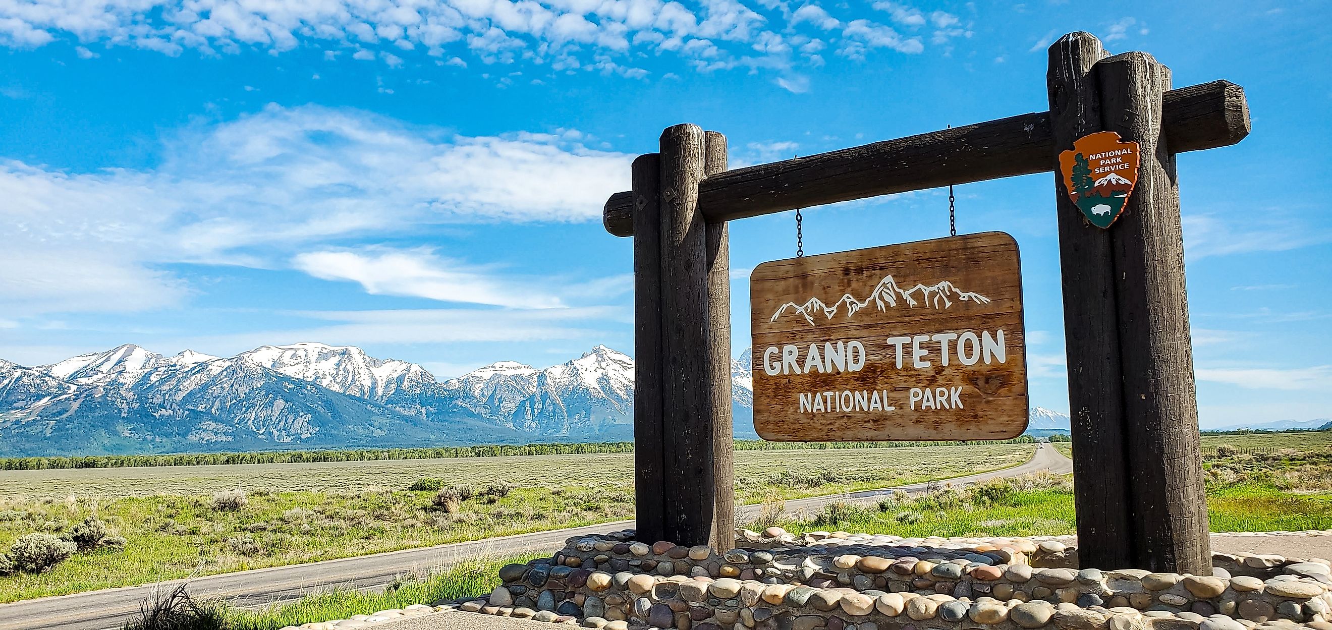 grand Teton national Park sign and background with grand Tetons