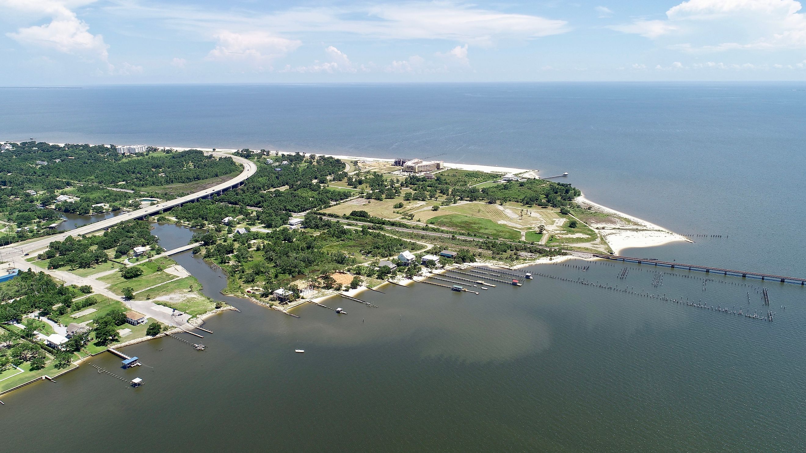 A gorgeous body of land on the edge of St Louis Bay. You can see piers along the shore line as well as a river that runs through the town.