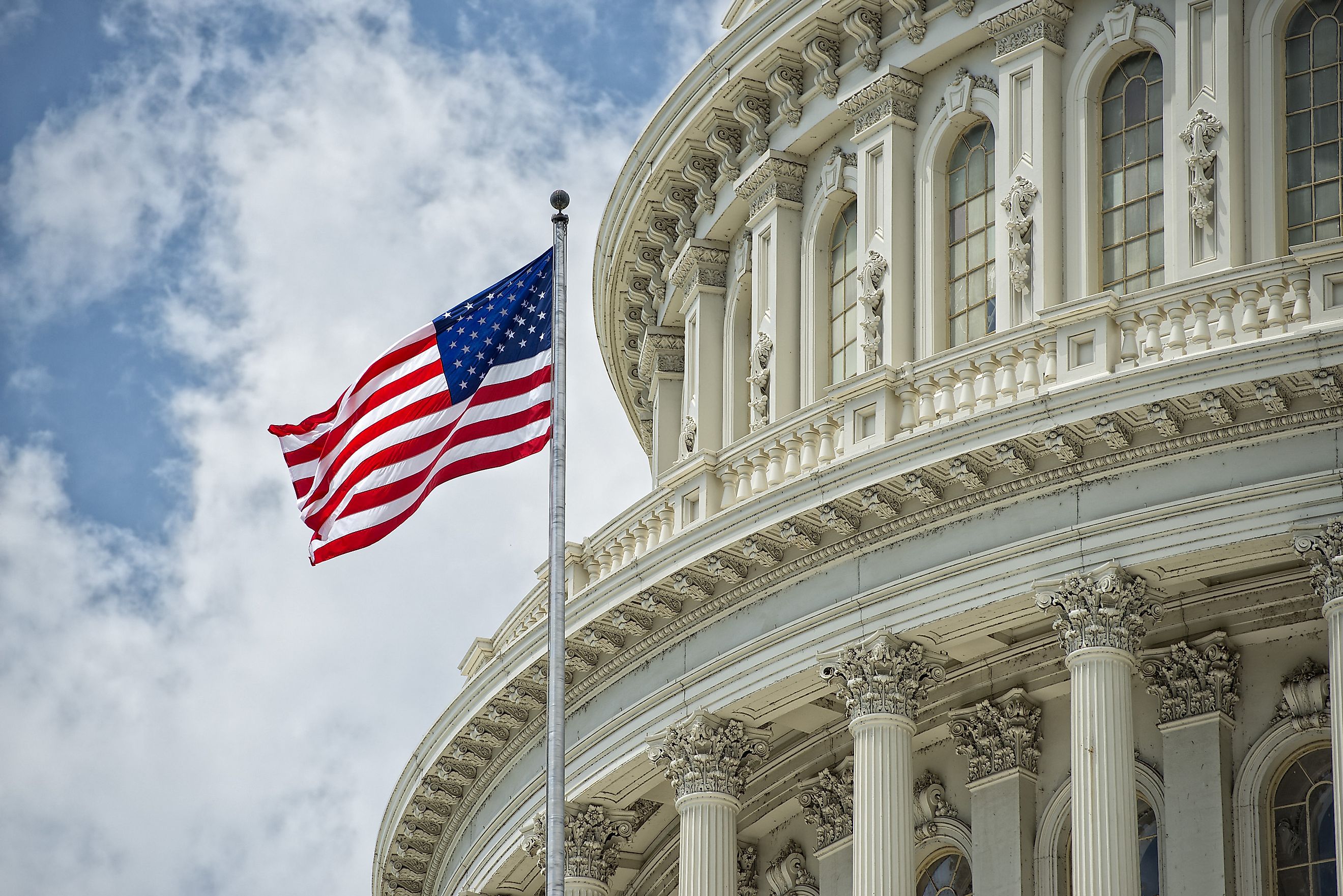 Washington DC Capitol dome detail with waving american flag
