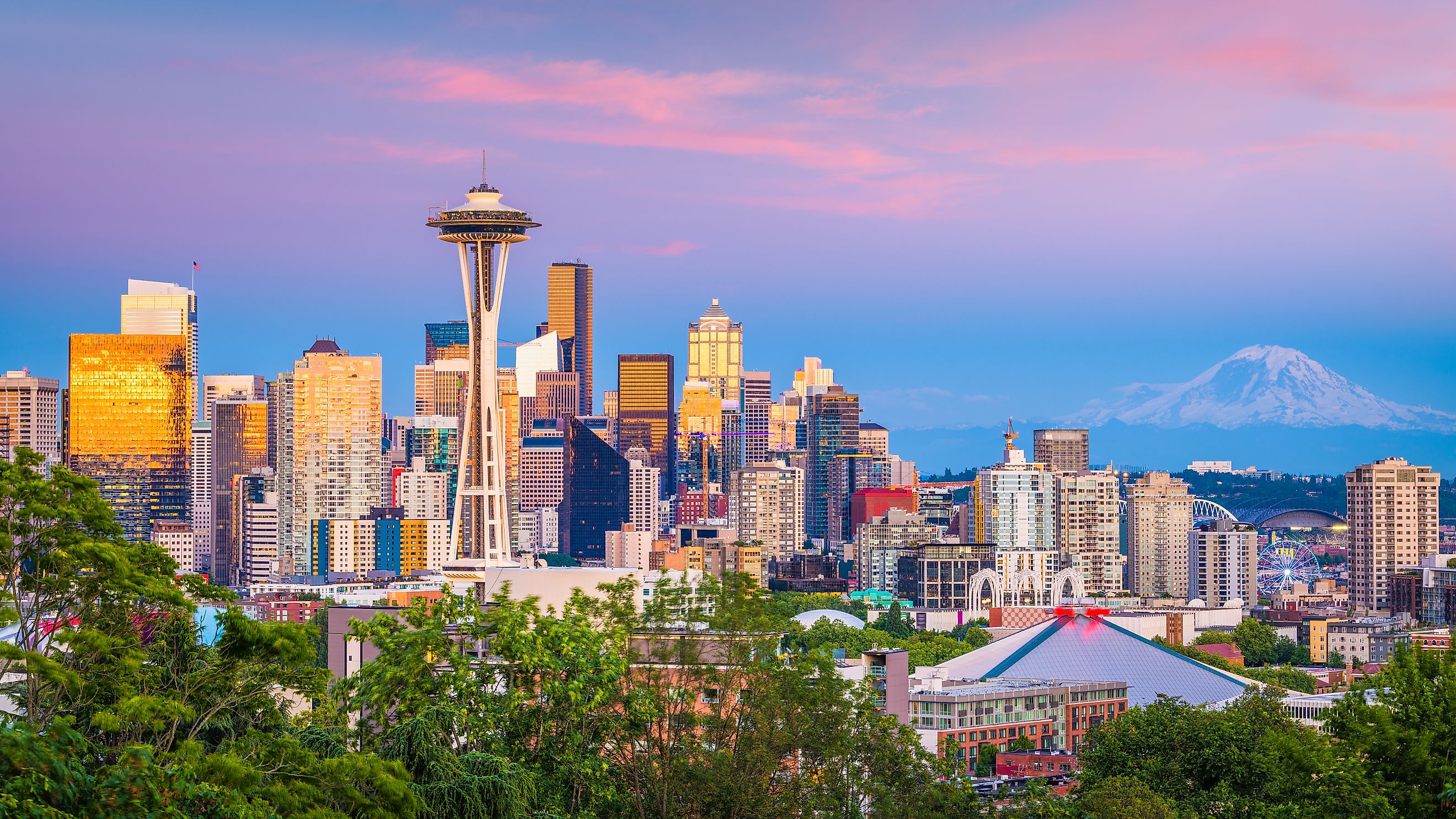 Seattle, Washington, USA downtown skyline at night with Mt. Rainier.