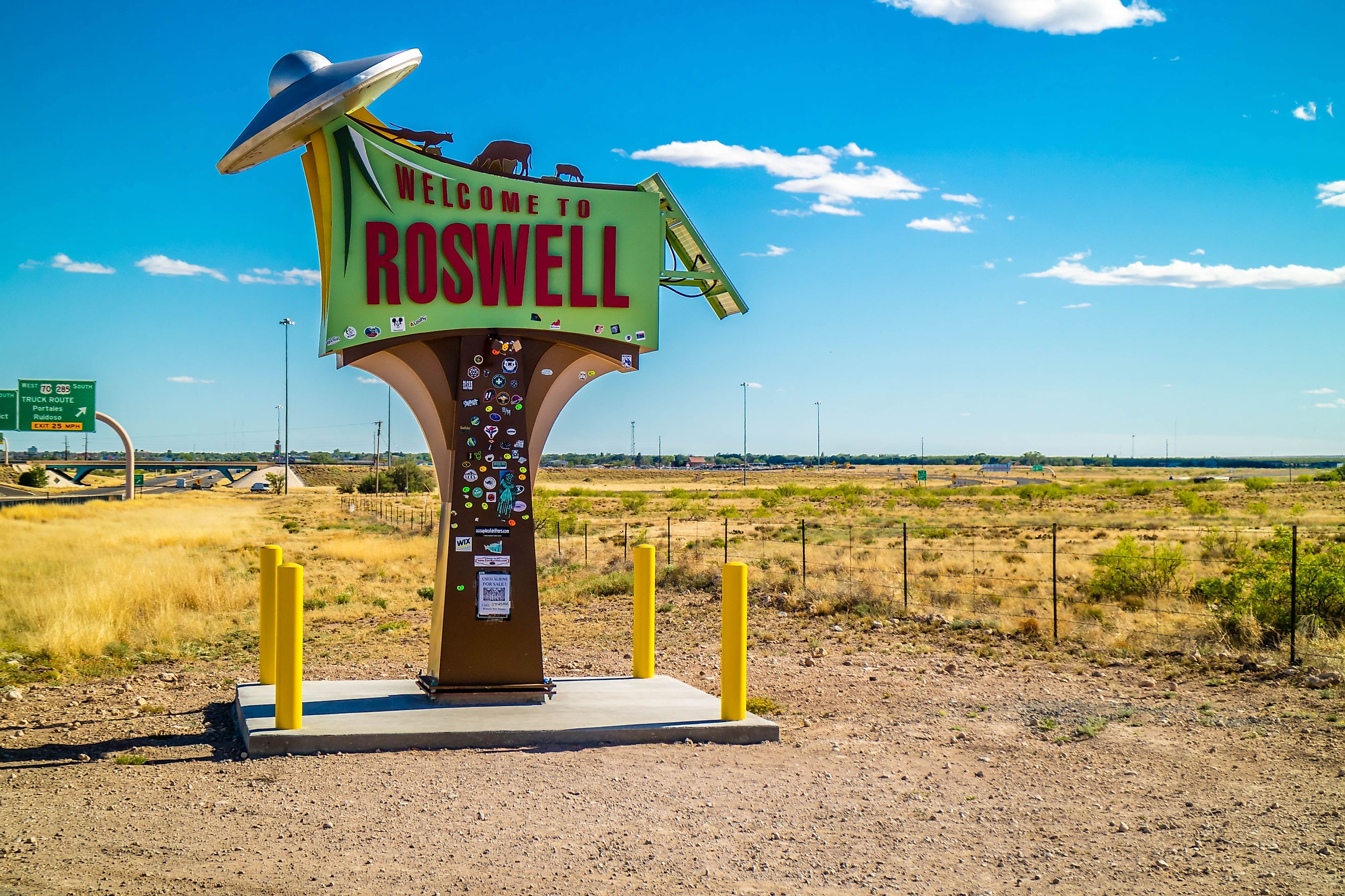 Roswell, NM: A welcoming signboard at the entry point of the town. Editorial credit: Cheri Alguire / Shutterstock.com