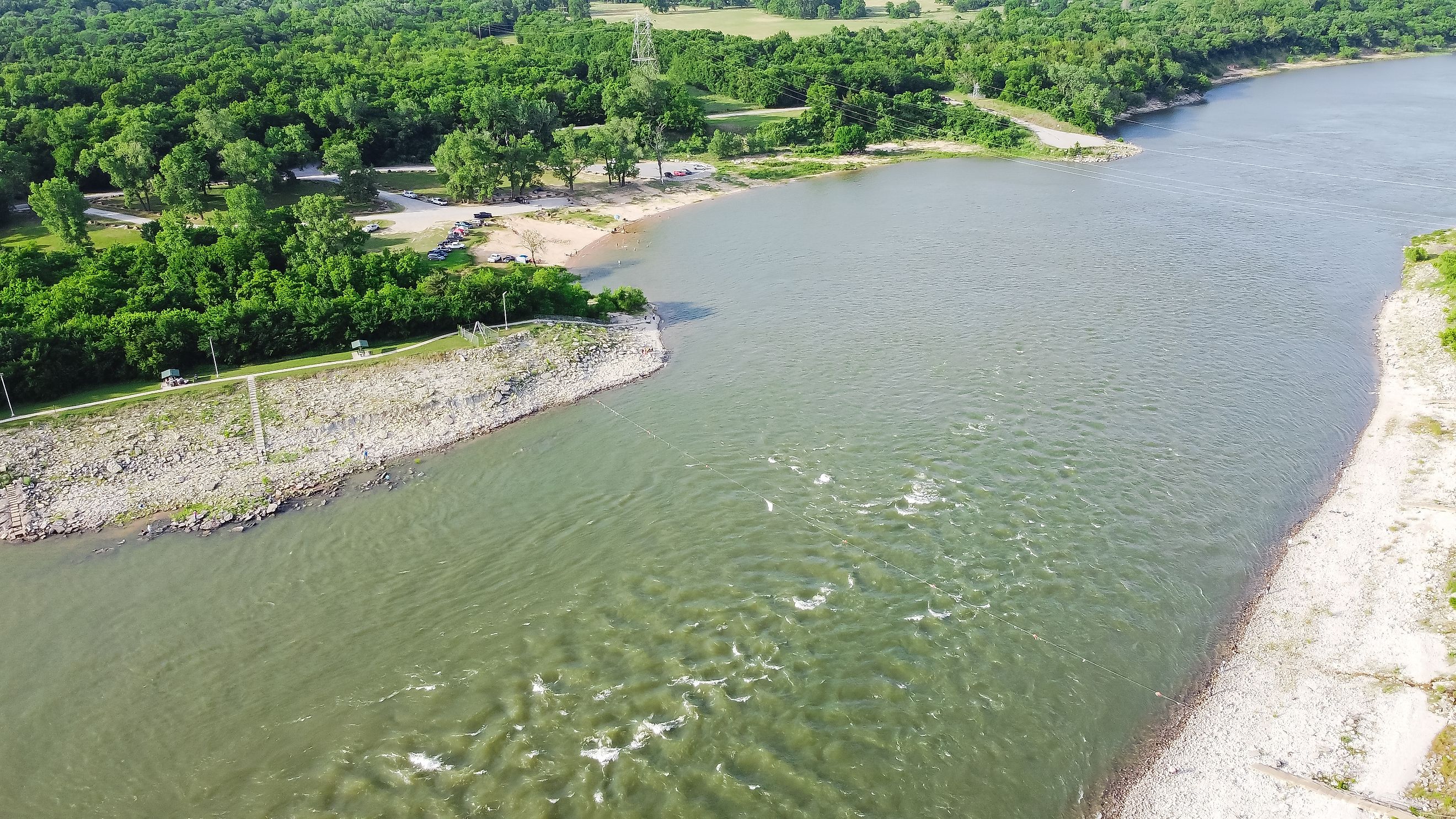 Top view Oklahoma side of Red River with strong water current generating from Denison Dam