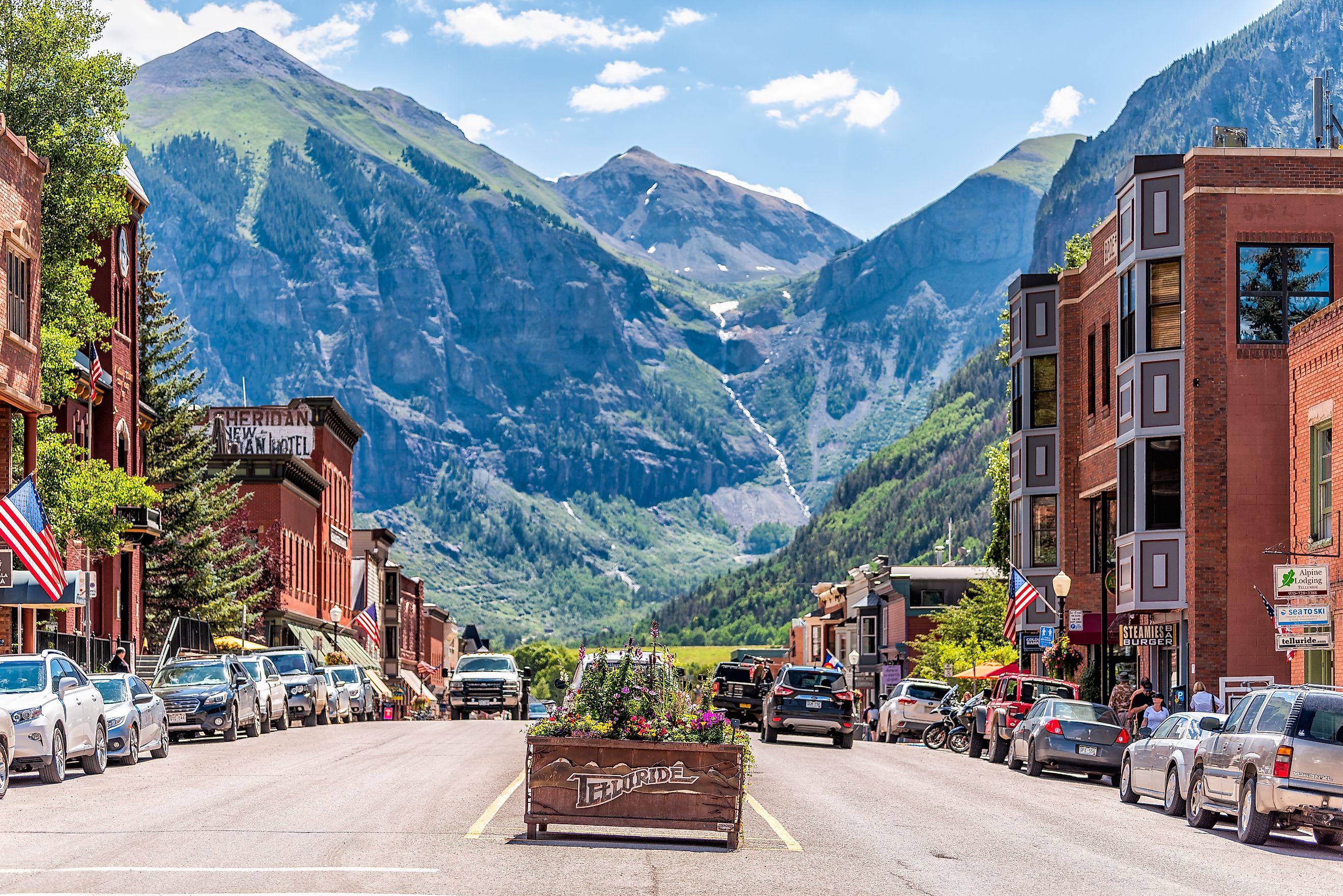 Small town village in Colorado with sign for city and flowers by historic architecture on main street mountain view. Editorial credit: Kristi Blokhin / Shutterstock.com