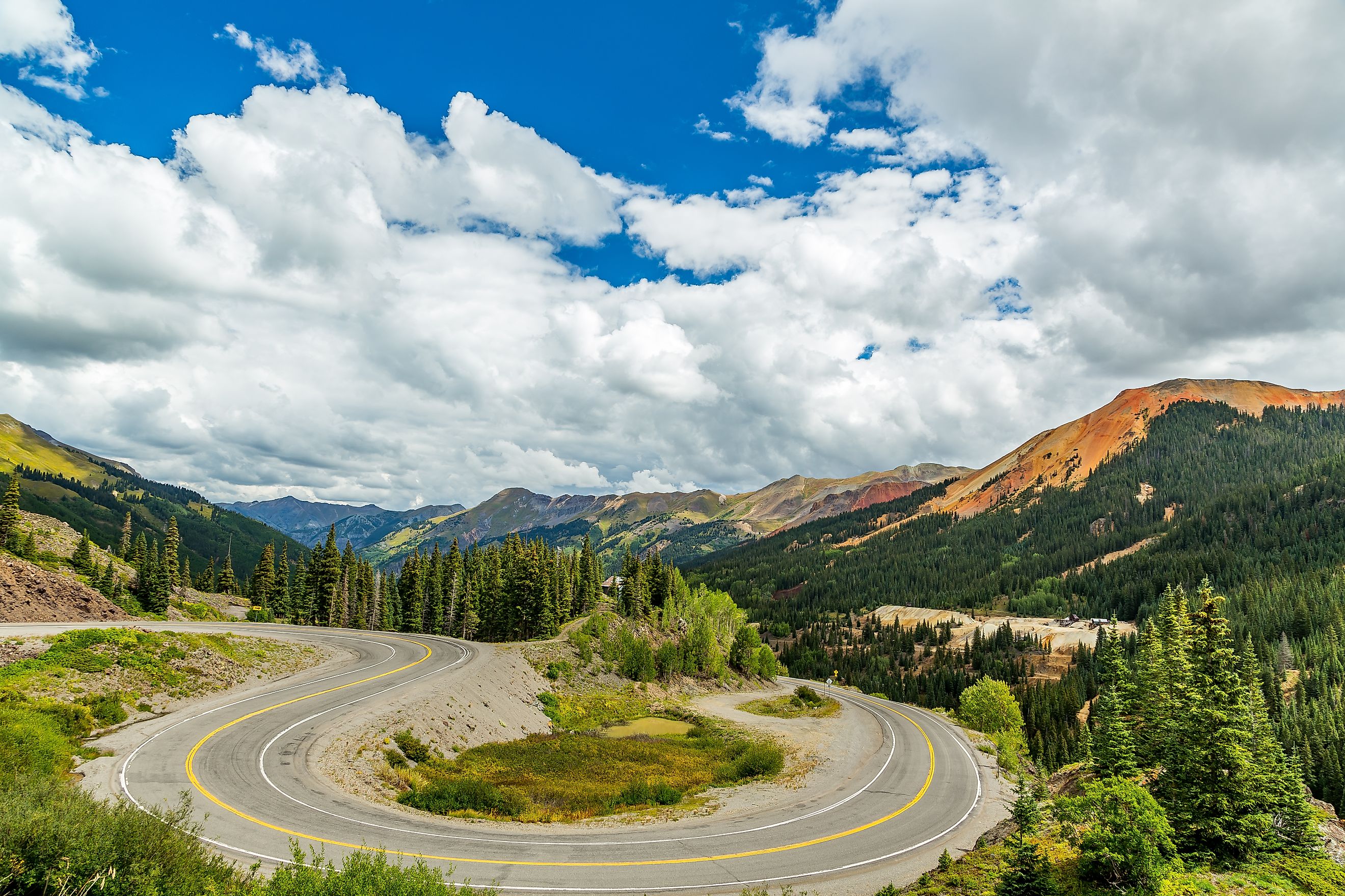 The San Juan Skyway forms a 233 mile loop in southwest Colorado traversing the heart of the San Juan Mountains featuring breathtaking mountain views.